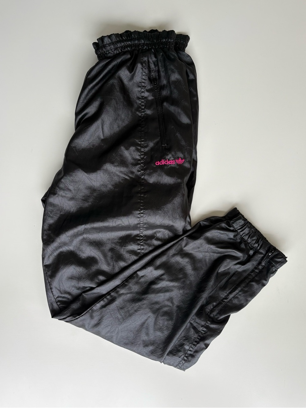 Adidas black Shiny Nylon Track Pants w/pink embroidered Adidas logo on hip. Sz M